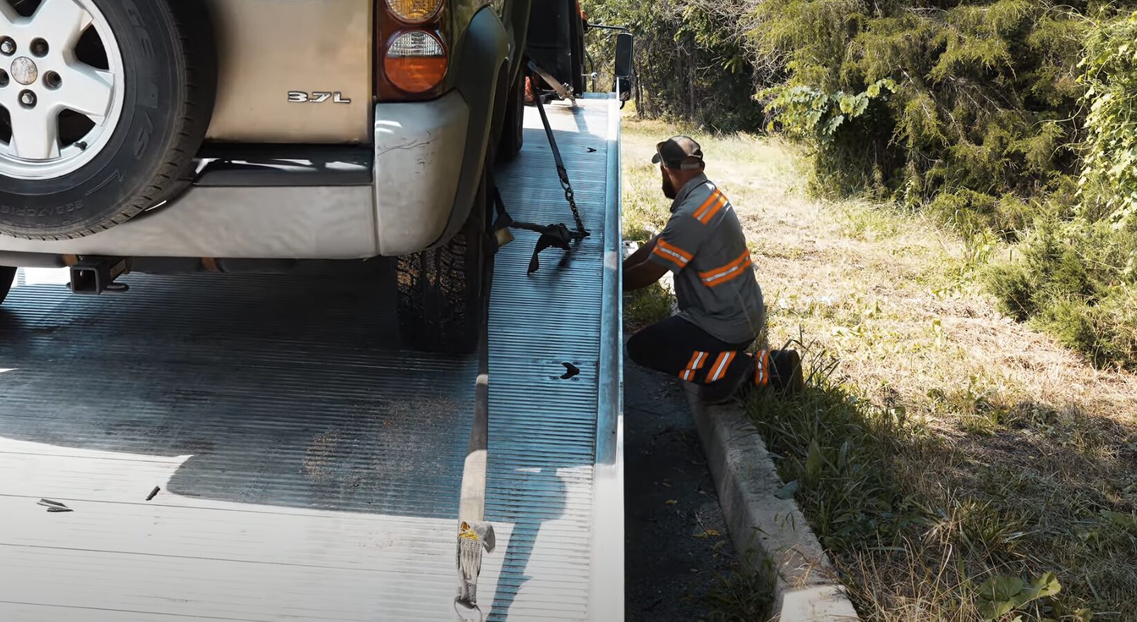 Flatbed Towing Service - Safe Vehicle Transport in Palmview, TX Professional flatbed towing service securing vehicle in Palmview, TX